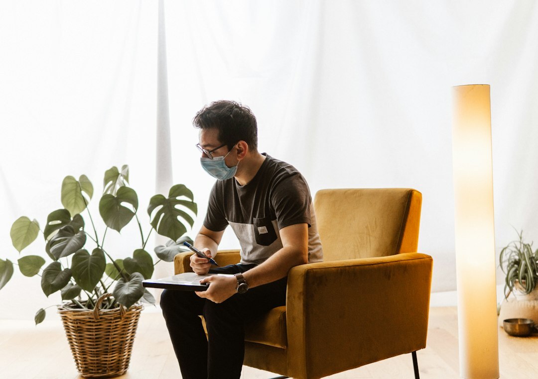Danish man reviewing financial documents at his desk